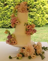 3 tier tall buttercream wedding with fresh flowers
